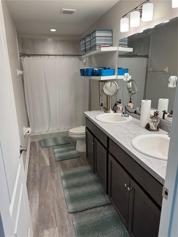 Bathroom, Dual Sink Vanities, Interior, Recessed Lighting, Wood Texture Flooring