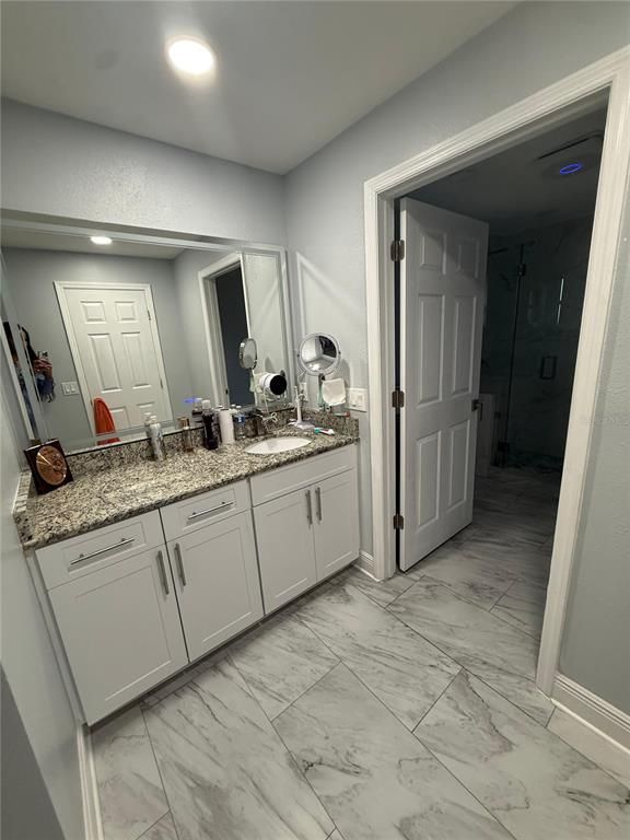 Bathroom, Dual Sink Vanities, Glass Shower, Interior, Marble, Recessed Lighting