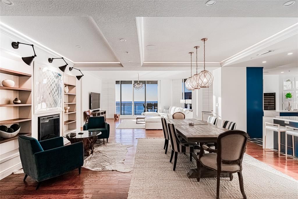 Chandelier, Dining room, Fireplace, Interior, Living room, Pendant Lights, Recessed Lighting, Water, Wood Texture Flooring