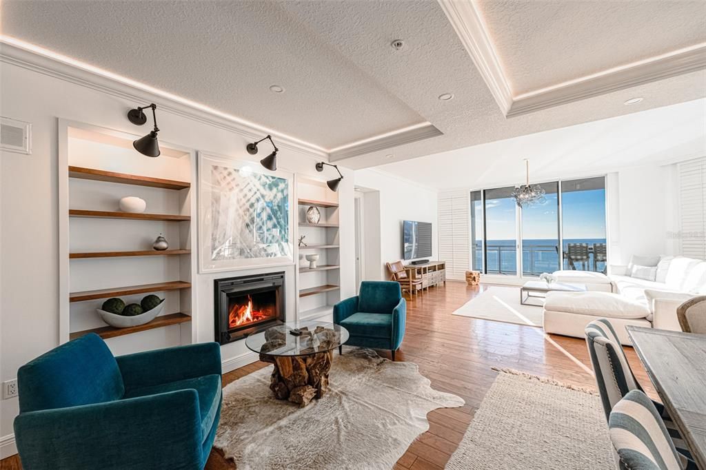 Chandelier, Dining room, Fireplace, Interior, Living room, Recessed Lighting, Water, Wood Texture Flooring