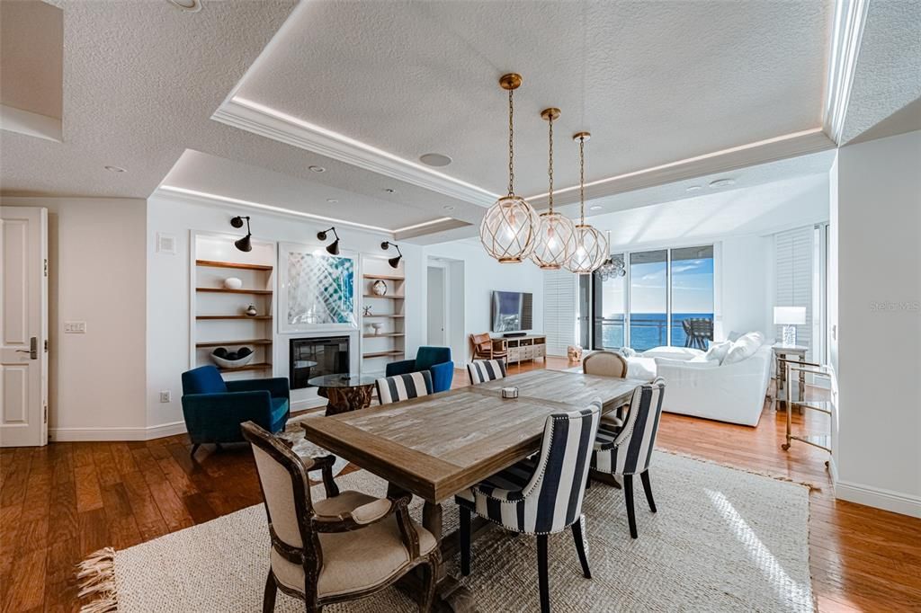 Chandelier, Dining room, Fireplace, Interior, Living room, Pendant Lights, Water, Wood Texture Flooring