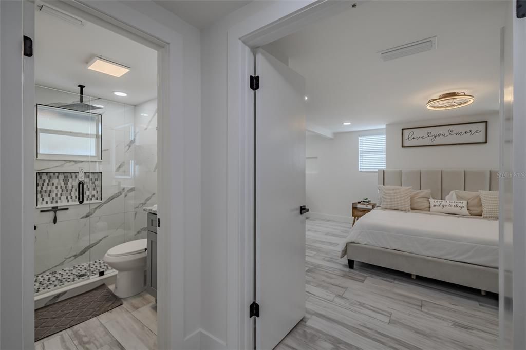 Bathroom, Bedroom, Glass Shower, Interior, Marble Walls, Recessed Lighting, Wood Texture Flooring