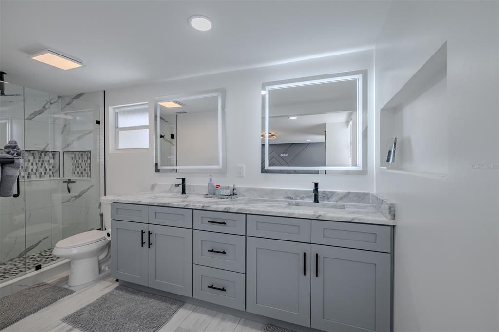 Bathroom, Dual Sink Vanities, Glass Shower, Interior, Marble Walls, Recessed Lighting