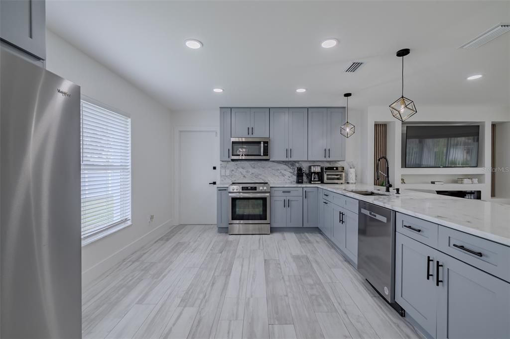 Interior, Kitchen, Pendant Lights, Recessed Lighting, Stainless Steel Appliances, Wood Texture Flooring