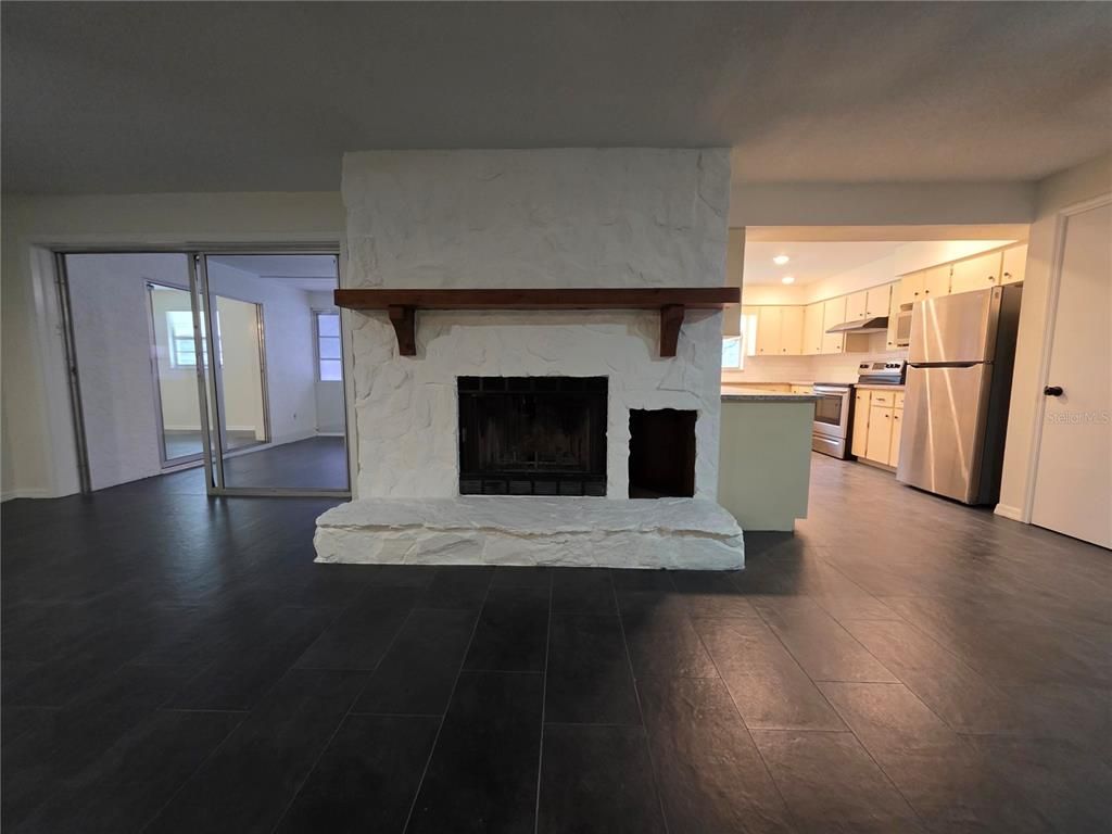 Fireplace, Interior, Kitchen, Marble Walls, Recessed Lighting, Wood Texture Flooring