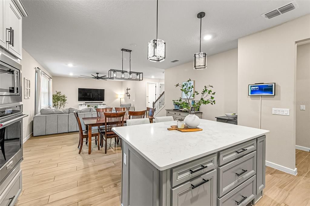 Dining room, Interior, Kitchen, Living room, Pendant Lights, Recessed Lighting, Stainless Steel Appliances, Wood Texture Flooring