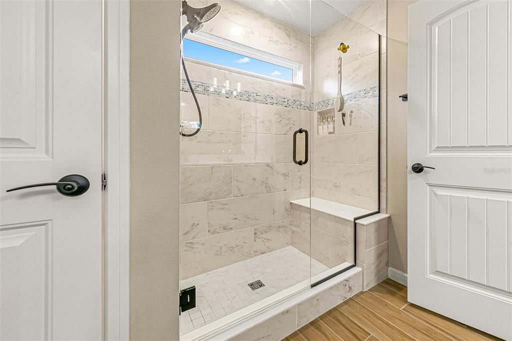 Bathroom, Glass Shower, Interior, Marble Walls, Wood Texture Flooring