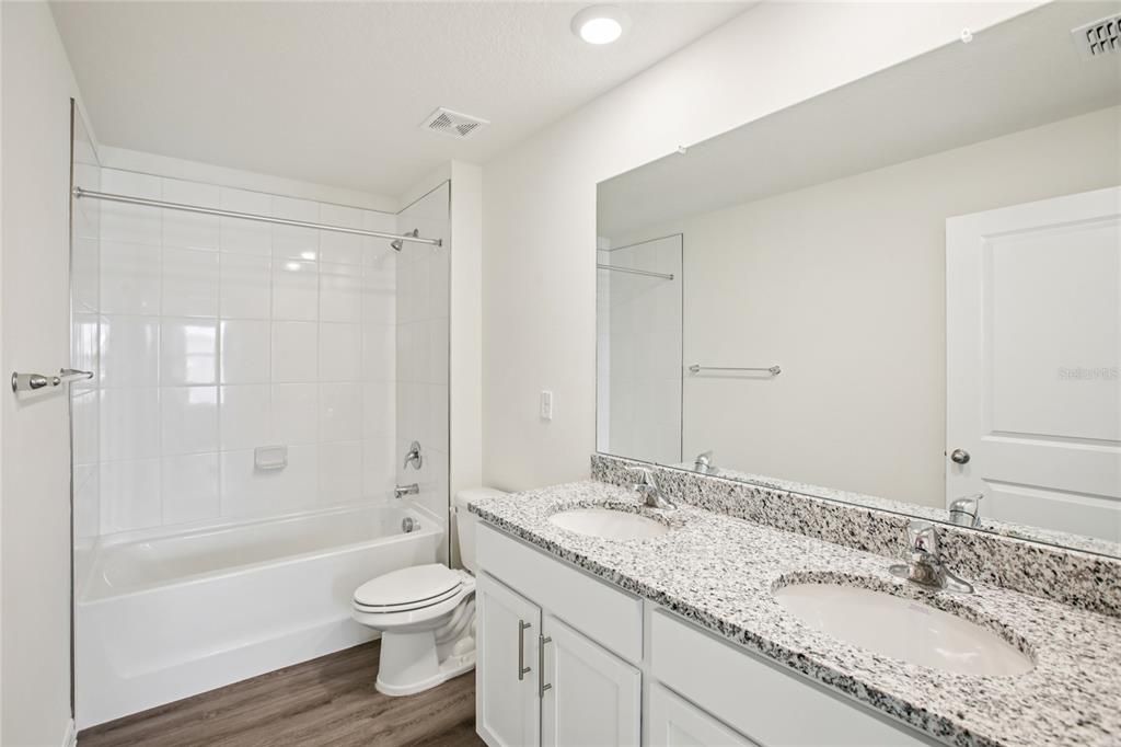 Bathroom, Dual Sink Vanities, Interior, Recessed Lighting, Wood Texture Flooring