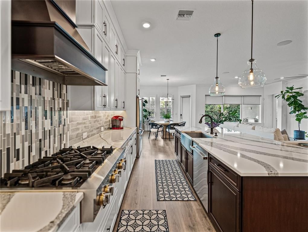 Dining room, Interior, Kitchen, Pendant Lights, Recessed Lighting, Stainless Steel Appliances, Wood Texture Flooring