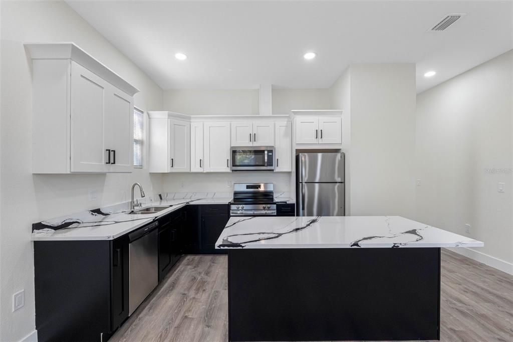 Interior, Kitchen, Recessed Lighting, Stainless Steel Appliances, Wood Texture Flooring