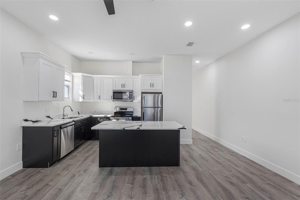 Interior, Kitchen, Recessed Lighting, Stainless Steel Appliances, Wood Texture Flooring