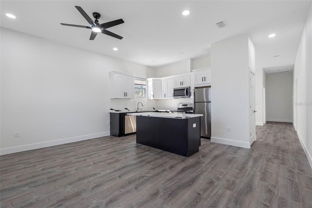 Interior, Kitchen, Recessed Lighting, Stainless Steel Appliances, Wood Texture Flooring