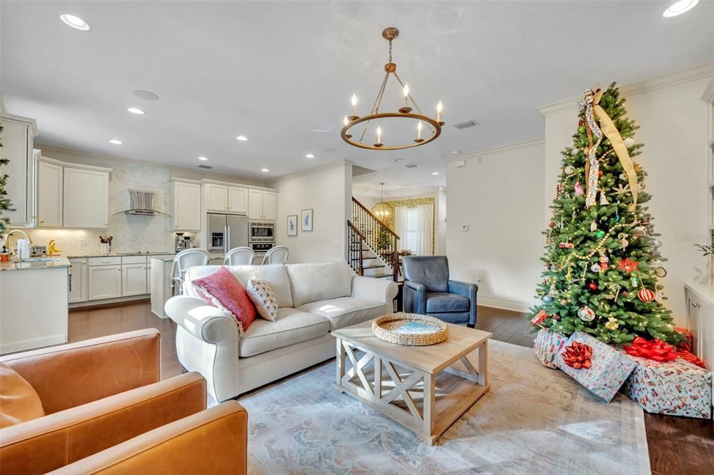 Chandelier, Interior, Kitchen, Living room, Pendant Lights, Recessed Lighting, Stainless Steel Appliances, Wood Texture Flooring