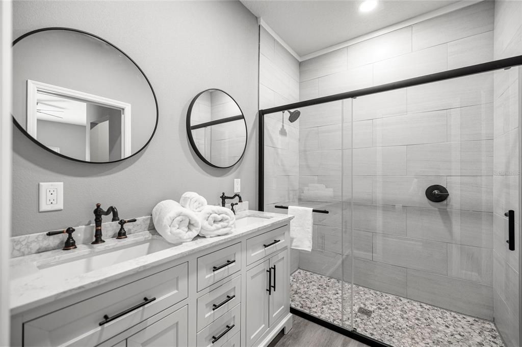 Bathroom, Dual Sink Vanities, Glass Shower, Interior, Recessed Lighting, Wood Texture Flooring