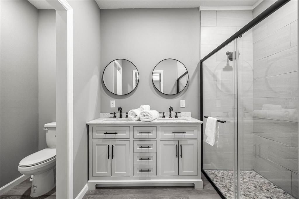 Bathroom, Dual Sink Vanities, Glass Shower, Interior, Wood Texture Flooring