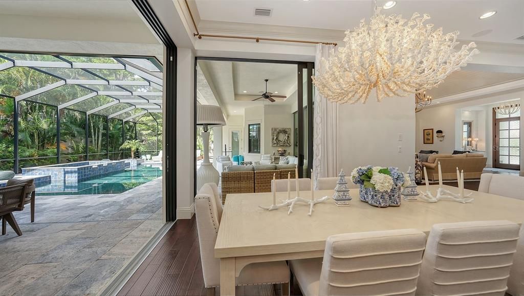 Chandelier, Dining room, Glass Ceilings, Interior, Pool, Recessed Lighting, Sun Room, Wood Texture Flooring