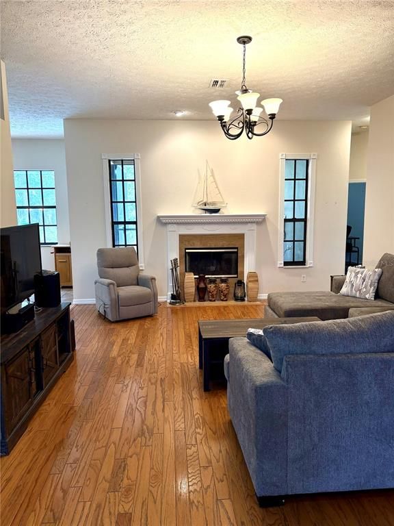 Chandelier, Fireplace, Interior, Living room, Recessed Lighting, Wood Texture Flooring