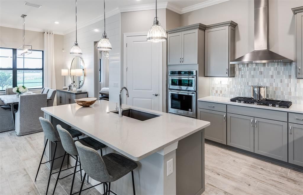 Dining room, Interior, Kitchen, Pendant Lights, Recessed Lighting, Stainless Steel Appliances, Water, Wood Texture Flooring