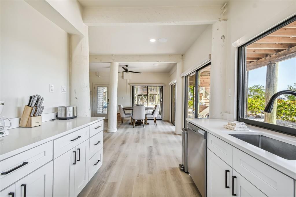 Dining room, Interior, Kitchen, Recessed Lighting, Stainless Steel Appliances, Wood Texture Flooring