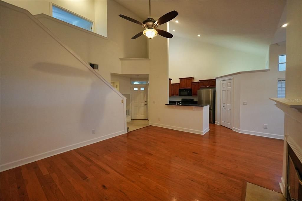 Empty room, Interior, Kitchen, Recessed Lighting, Stainless Steel Appliances, Wood Texture Flooring