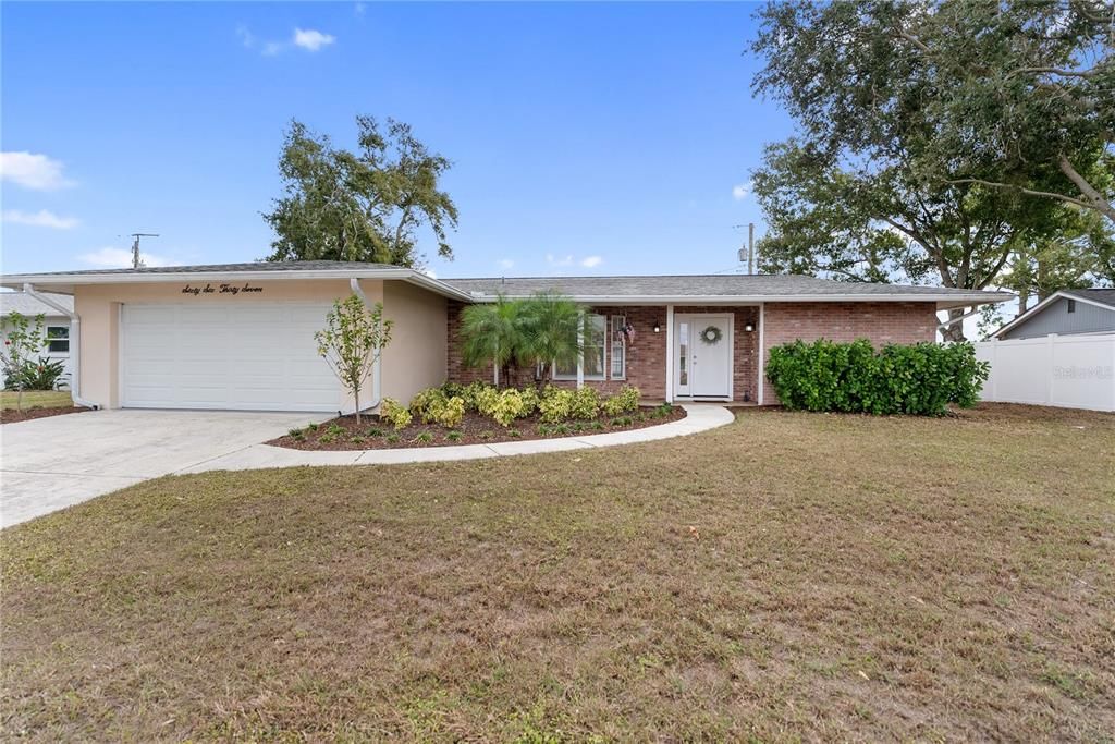 Attached, Backyard, Exterior, Facade, Brick Facade, Ranch