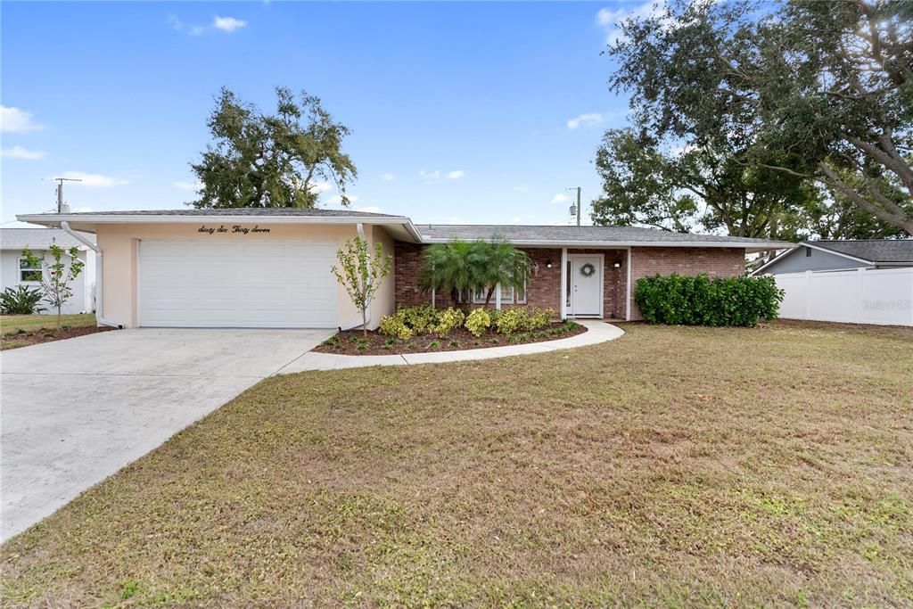 Attached, Backyard, Exterior, Facade, Brick Facade, Ranch