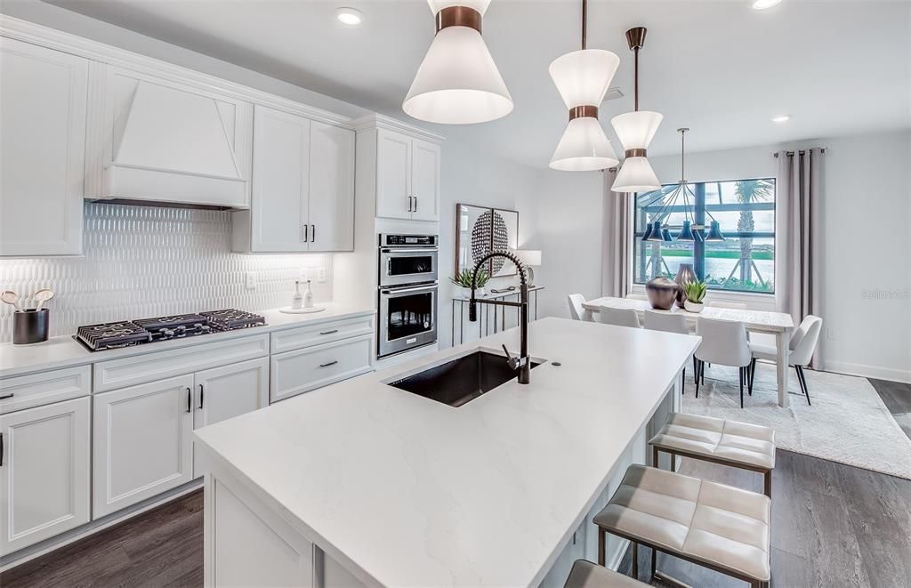 Dining room, Interior, Kitchen, Pendant Lights, Recessed Lighting, Stainless Steel Appliances, Water, Wood Texture Flooring