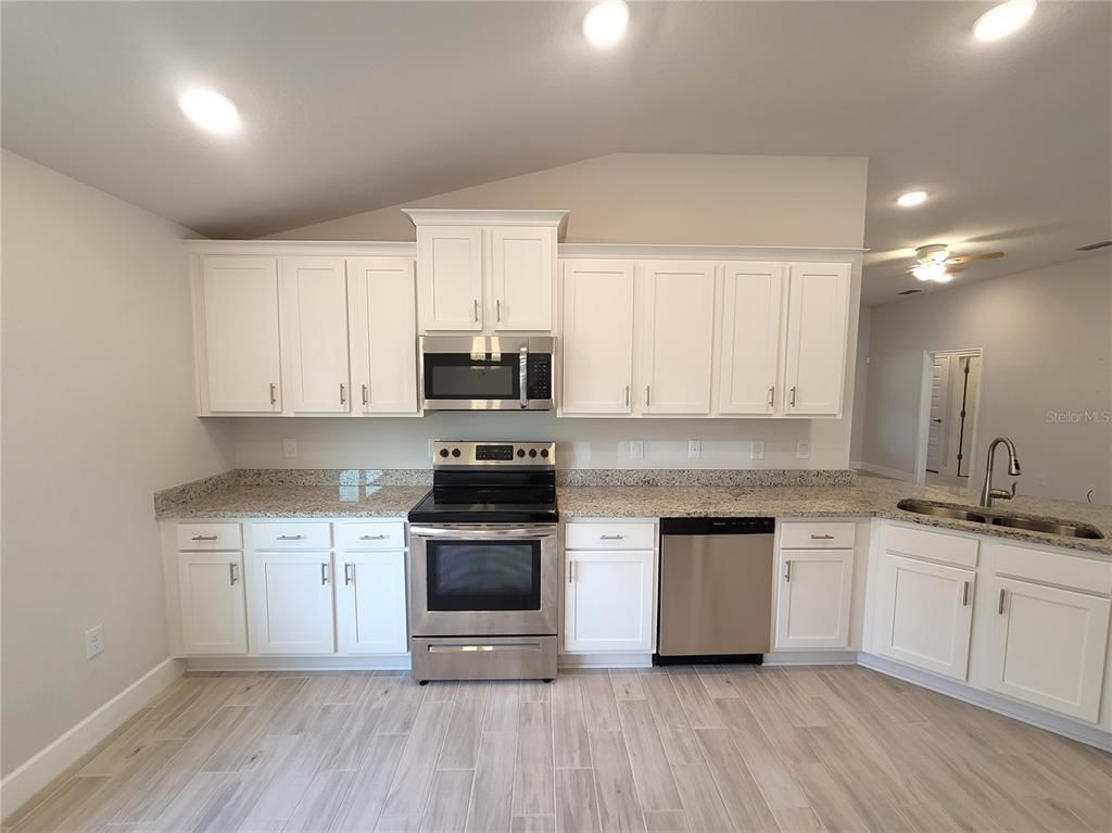 Interior, Kitchen, Recessed Lighting, Stainless Steel Appliances, Wood Texture Flooring