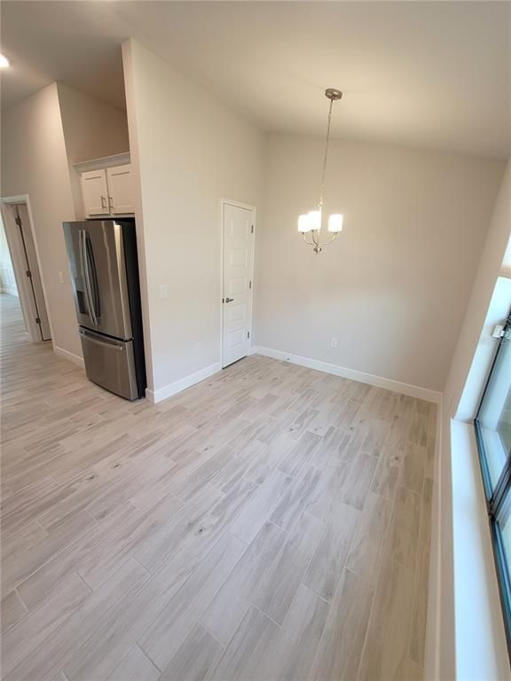 Chandelier, Empty room, Interior, Kitchen, Pendant Lights, Stainless Steel Appliances, Wood Texture Flooring