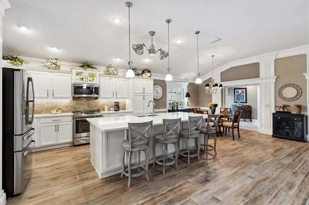 Dining room, Interior, Kitchen, Pendant Lights, Recessed Lighting, Stainless Steel Appliances, Wood Texture Flooring