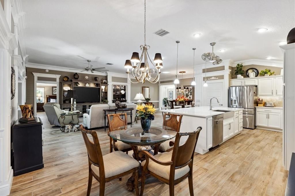 Chandelier, Dining room, Interior, Kitchen, Living room, Pendant Lights, Recessed Lighting, Stainless Steel Appliances, Wood Texture Flooring