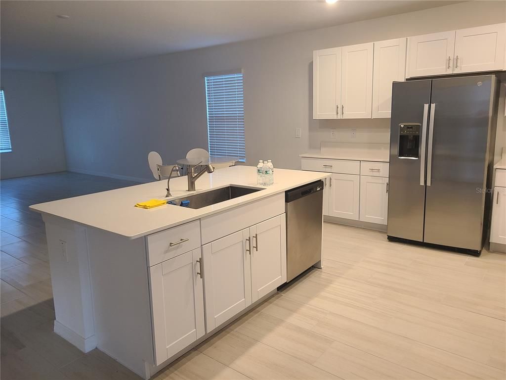 Dining room, Interior, Kitchen, Recessed Lighting, Stainless Steel Appliances, Wood Texture Flooring