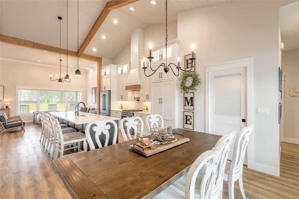 Chandelier, Dining room, Interior, Kitchen, Living room, Pendant Lights, Recessed Lighting, Wooden Beams, Wood Texture Flooring
