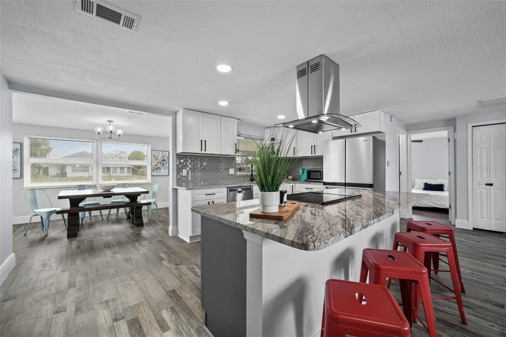 Chandelier, Dining room, Interior, Kitchen, Recessed Lighting, Stainless Steel Appliances, Wood Texture Flooring