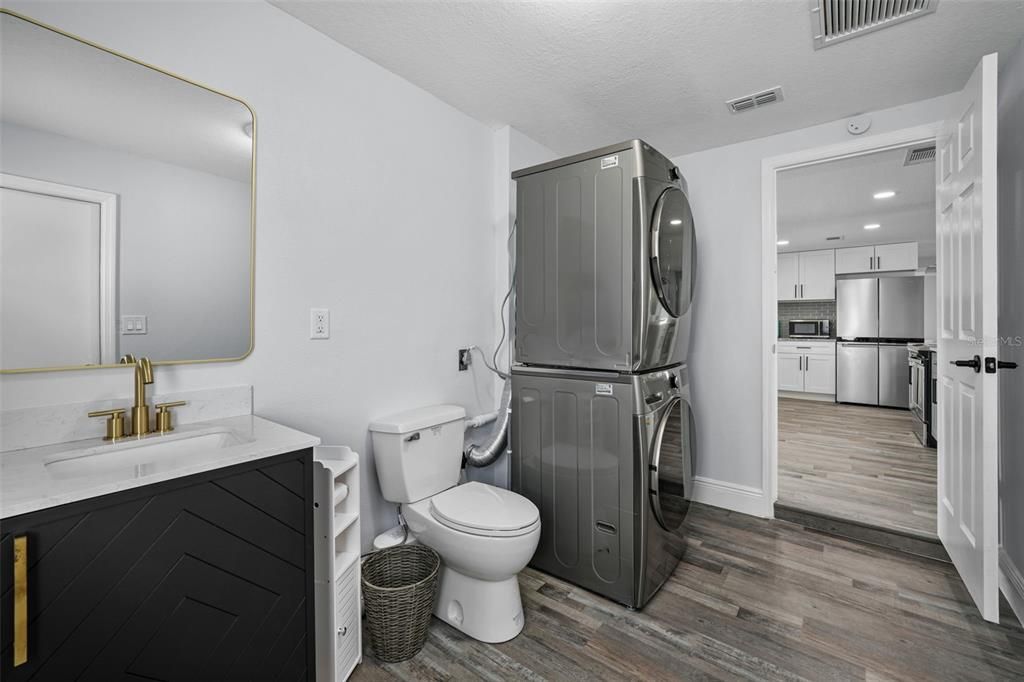 Interior, Kitchen, Recessed Lighting, Stainless Steel Appliances, Washer, Wood Texture Flooring