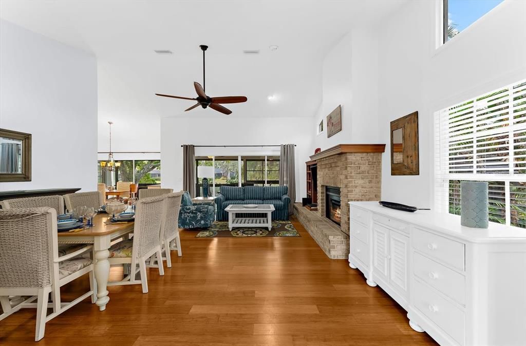 Dining room, Fireplace, Interior, Living room, Recessed Lighting, Wood Texture Flooring