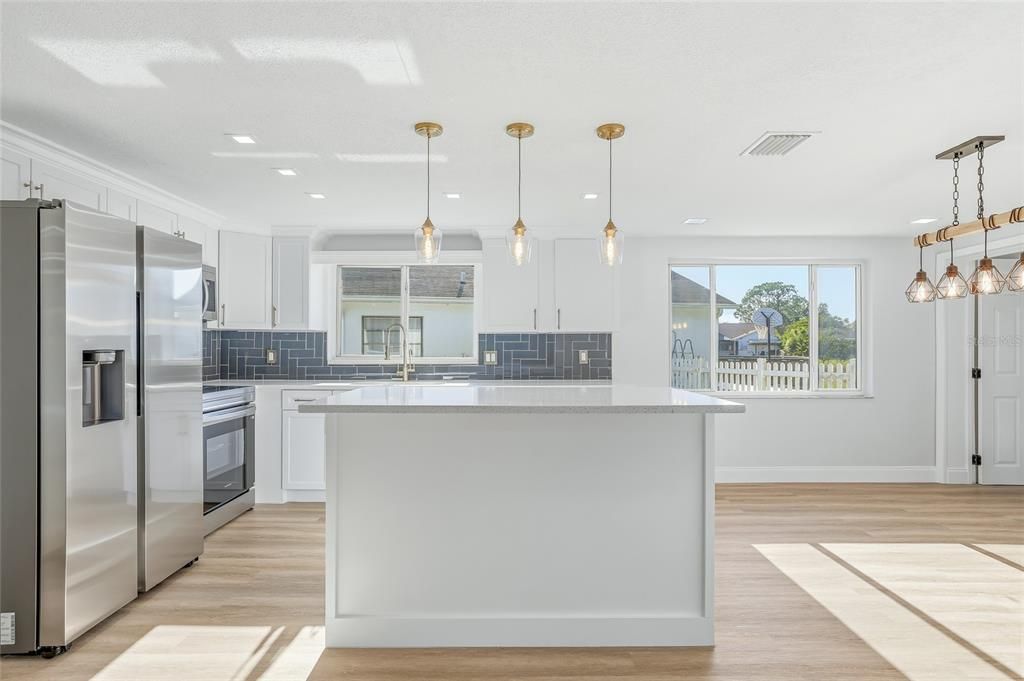 Interior, Kitchen, Pendant Lights, Recessed Lighting, Stainless Steel Appliances, Wood Texture Flooring