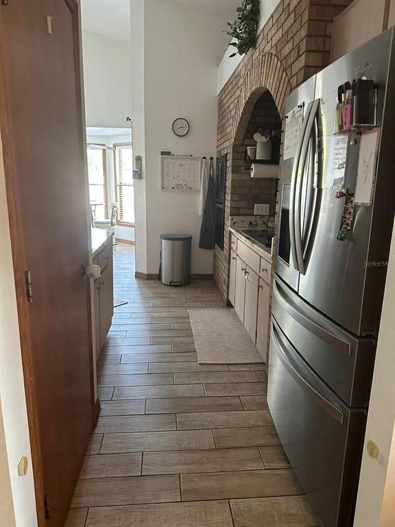 Fireplace, Interior, Kitchen, Stone Walls, Washer, Wood Texture Flooring