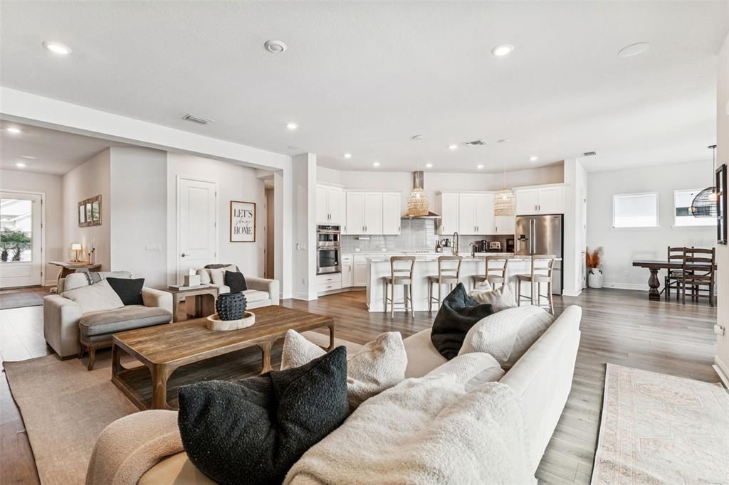 Dining room, Interior, Kitchen, Living room, Pendant Lights, Recessed Lighting, Stainless Steel Appliances, Wood Texture Flooring