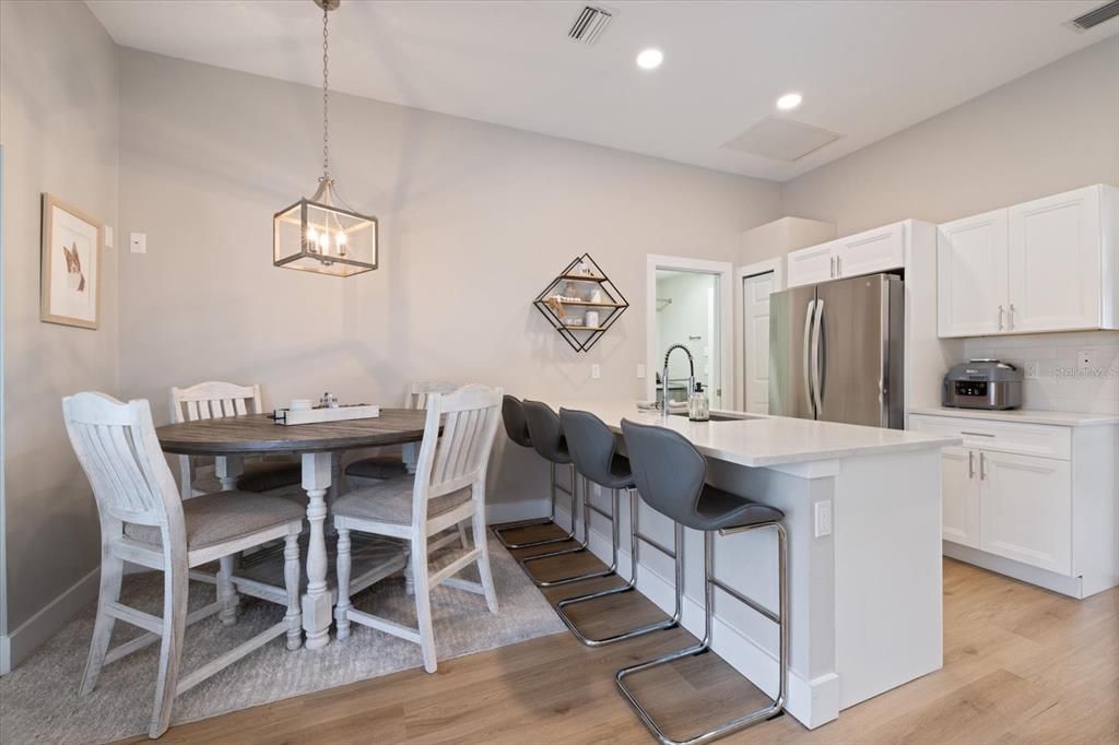 Dining room, Interior, Kitchen, Pendant Lights, Recessed Lighting, Stainless Steel Appliances, Wood Texture Flooring