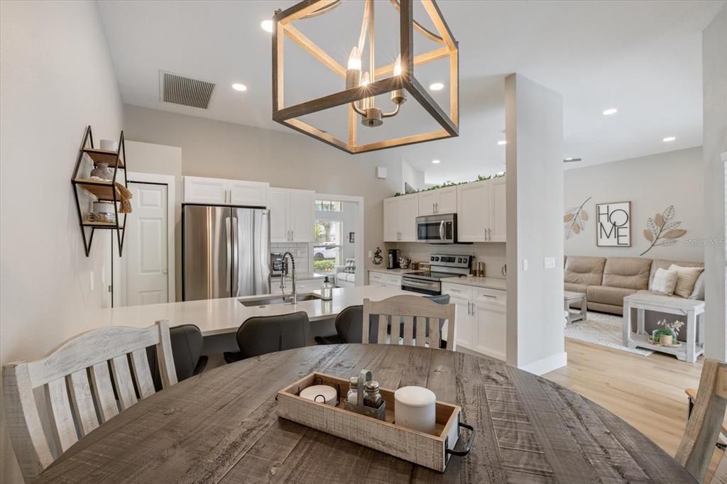 Dining room, Interior, Kitchen, Living room, Pendant Lights, Recessed Lighting, Stainless Steel Appliances, Wood Texture Flooring