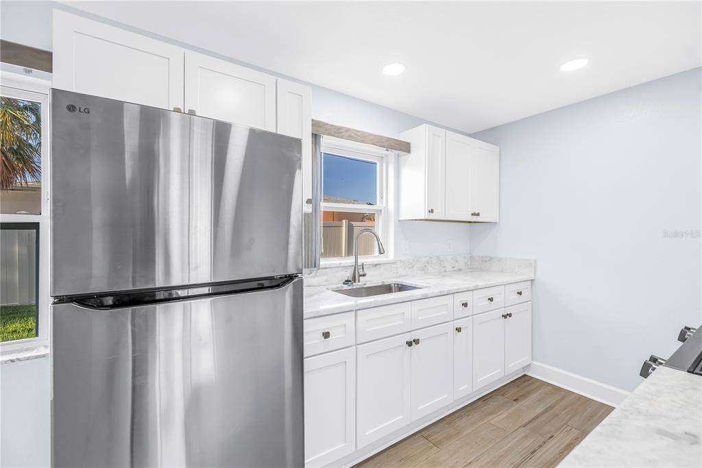 Interior, Kitchen, Recessed Lighting, Stainless Steel Appliances, Wood Texture Flooring