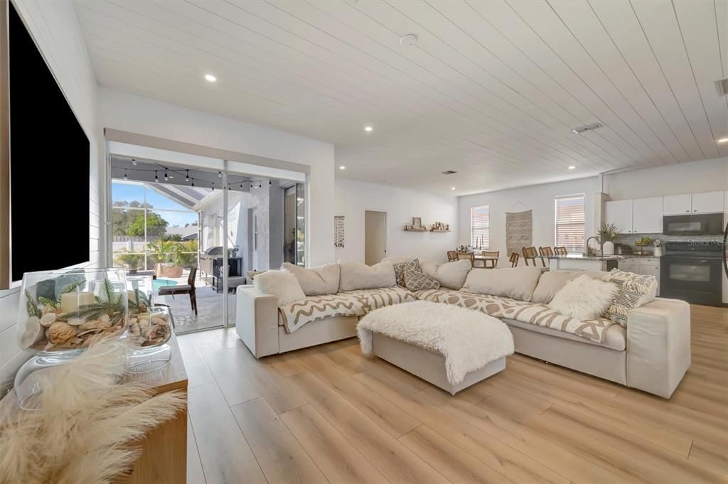 Dining room, Interior, Kitchen, Living room, Recessed Lighting, Stainless Steel Appliances, Wood Texture Flooring
