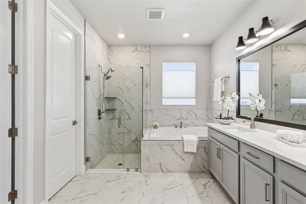 Bathroom, Dual Sink Vanities, Glass Shower, Interior, Marble, Marble Walls, Recessed Lighting