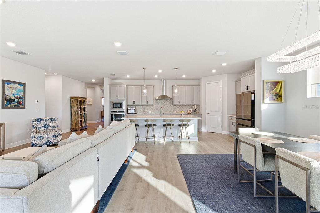 Dining room, Interior, Kitchen, Living room, Pendant Lights, Recessed Lighting, Stainless Steel Appliances, Wood Texture Flooring