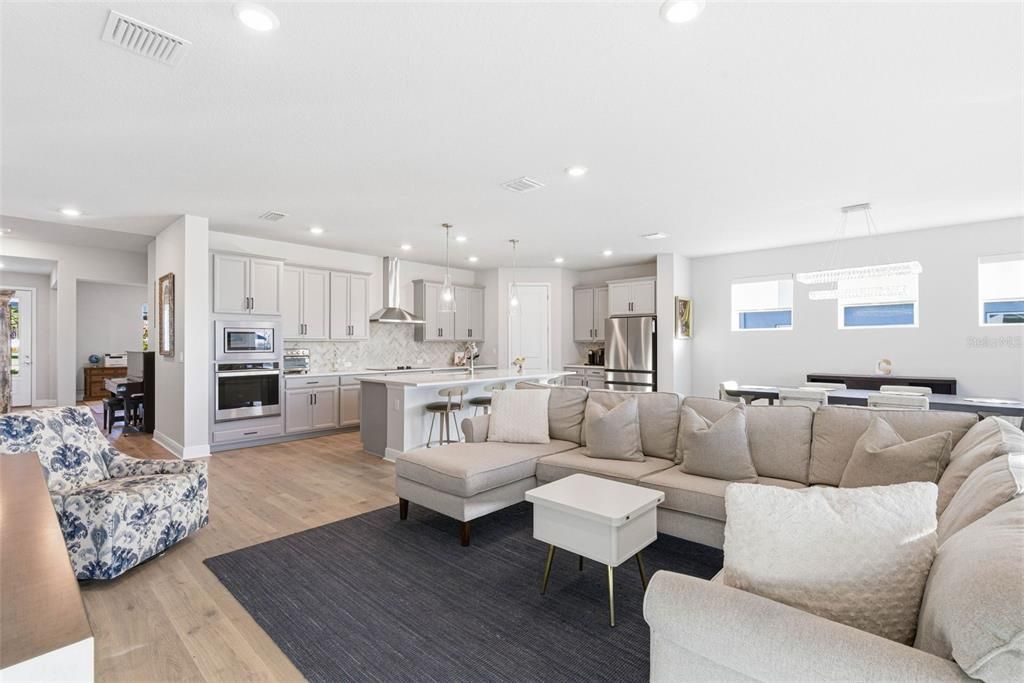 Dining room, Interior, Kitchen, Living room, Pendant Lights, Recessed Lighting, Stainless Steel Appliances, Wood Texture Flooring