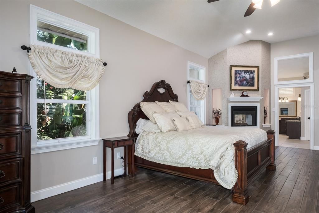 Bedroom, Fireplace, Interior, Recessed Lighting, Wood Texture Flooring