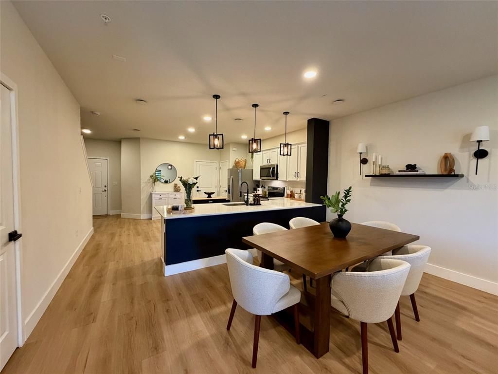 Dining room, Interior, Kitchen, Pendant Lights, Recessed Lighting, Stainless Steel Appliances, Wood Texture Flooring