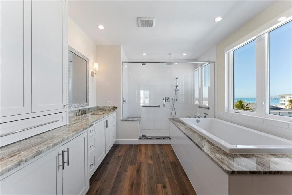 Bathroom, Dual Sink Vanities, Glass Shower, Interior, Recessed Lighting, Water, Wood Texture Flooring