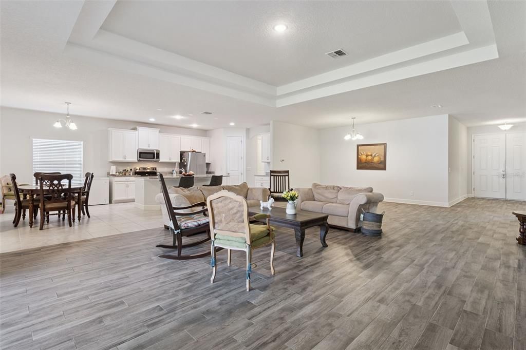 Chandelier, Dining room, Interior, Kitchen, Living room, Pendant Lights, Recessed Lighting, Stainless Steel Appliances, Wood Texture Flooring